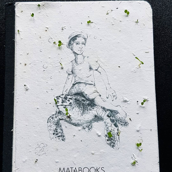 Cover eines Buches mit eingearbeiteten Samen, die bereits zu blühen beginnen
